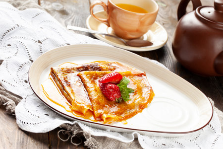 Pancakes with honey in a bowl. selective focus.の写真素材