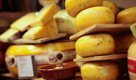 Cheese heads are on the shelves. selective focus.の写真素材