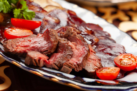 Raw-cured meat in a plate. selective focus.の写真素材