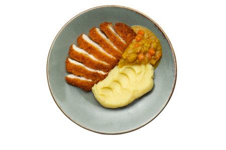 Fried chicken breast and mashed potatoes in a plate. isolated on white. view from above.の写真素材