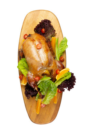 Cooked duck on a wooden board. isolated on white.の写真素材