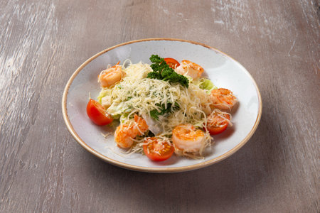 Shrimp salad in a plate on a brown background. selective focus.の写真素材