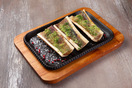 Cooked marrow bones in a plate on a brown background. selective focus.の写真素材