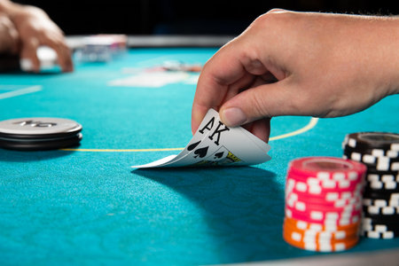 Poker. The hand holds the cards ace and king of spades. selective focus.の写真素材