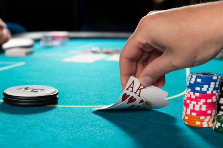 Poker. Ace and king of hearts cards in hand. selective focus.