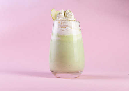 Green milkshake on a light background. Selective focus.の写真素材
