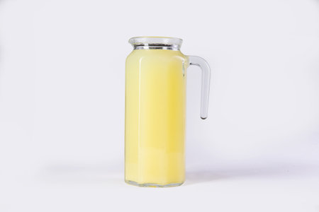 Fruit drink in a decanter. On a light background. Selective focus.の写真素材