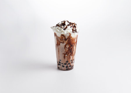 Milkshake with chocolate syrup and whipped cream in a glass. on a white background. Selective focus.の写真素材