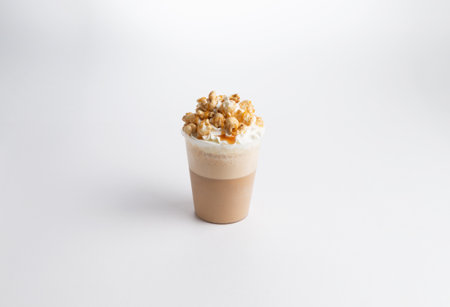 Cappuccino coffee with nuts in a glass. on a white background. Selective focus.の写真素材