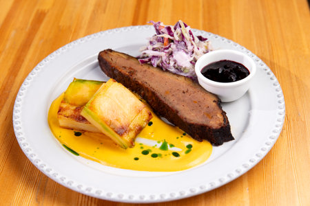 Brisket in a plate. On a wooden table. Selective focus.の写真素材