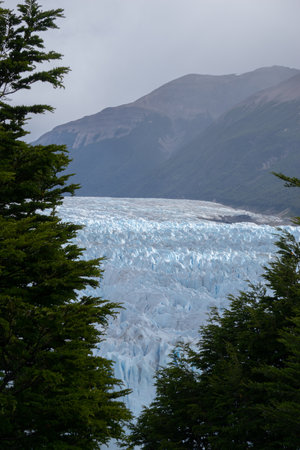 Impressive vertical photo of the Perito Moreno Glacier located in the Andes Mountains in Patagonia Argentinaの写真素材
