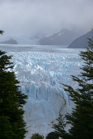 Impressive vertical photo of the Perito Moreno Glacier located in the Andes Mountains in Patagonia Argentinaの写真素材