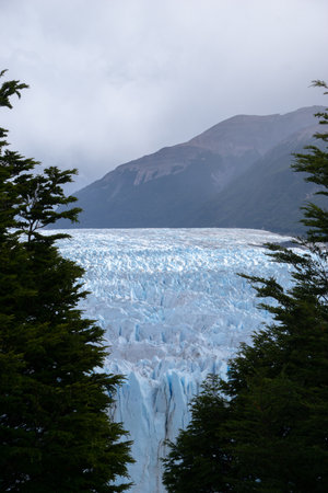 Impressive vertical photo of the Perito Moreno Glacier located in the Andes Mountains in Patagonia Argentinaの写真素材
