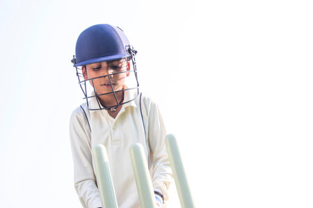 a boy wicket keeper during cricket gameの写真素材