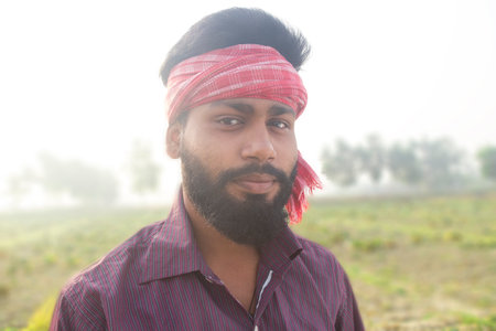 Indian Young Rural Farmer  Standing in agricultural fieldの写真素材