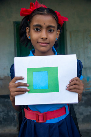 Indian Rural School Girl holding notebook in schoolの写真素材