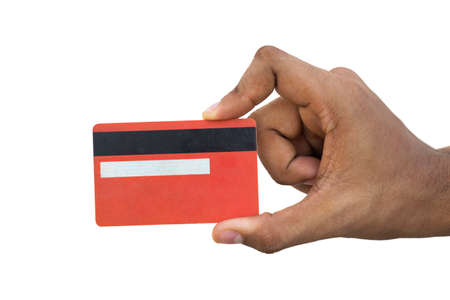 A human hand holding a credit cardの写真素材