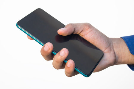Hand holding of a mobile phoneの写真素材