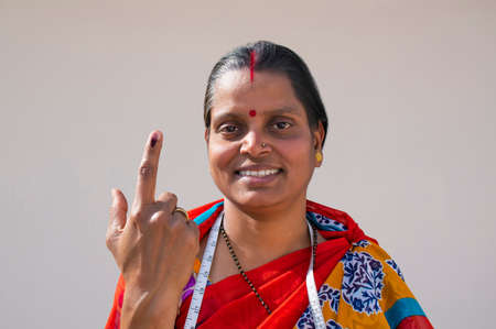 PORTRAIT OF A RURAL WOMAN voters mark on fingerの写真素材