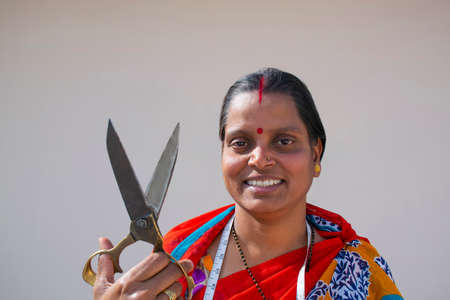 PORTRAIT OF A RURAL WOMAN Holding Scissorsの写真素材