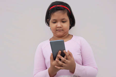 Happy child using a smart phone