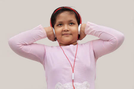 Girl listening to music on headphonesの写真素材
