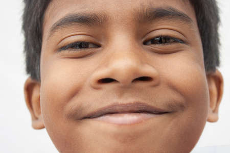 Close-Up Portrait Of Boy On White backgroundの写真素材