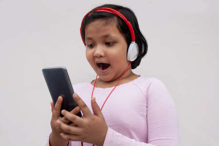 Surprised Indian girl While watching movieの写真素材