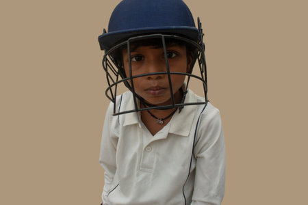 Portrait of boy wearing cricket helmetの写真素材