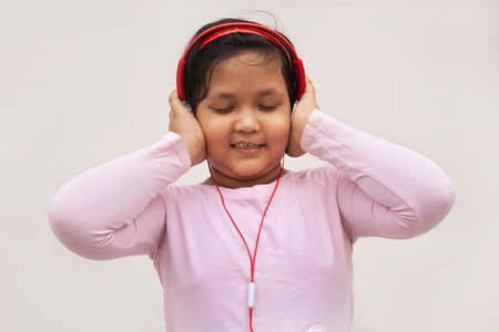 Girl listening to music on headphonesの写真素材