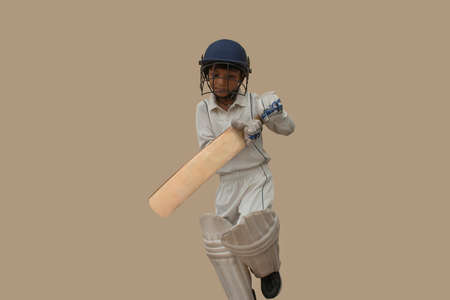 Portrait of boy Playing cricket During a Cricket Gameの写真素材