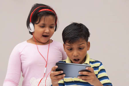 Surprised Indian Kids While watching movieの写真素材