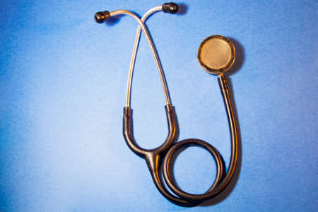 The Doctor's Stethoscope Is On A Blue Background