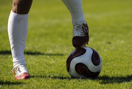soccer, football, player legs with a ballの写真素材