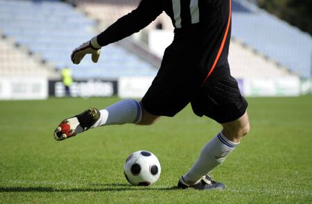 Soccer goalkeeper makes a free kickの写真素材
