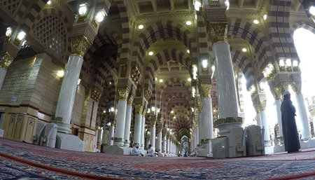 MADINAH, SAUDI ARABIA, April 7 2017 - Muslim pilgrims from all over the world gathered at the Masjidil Nabawi Haram Mosque waiting for pray in Madinah. Fisheye of Sunset View Out of mosque Nabawi.のeditorial素材