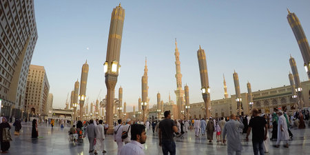 MADINAH, SAUDI ARABIA, April 7 2017 - Muslim pilgrims from all over the world gathered at the Masjidil Nabawi Haram Mosque waiting for pray in Madinah. Fisheye of Sunset View Out of mosque Nabawi.のeditorial素材