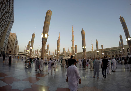 MADINAH, SAUDI ARABIA, April 7 2017 - Muslim pilgrims from all over the world gathered at the Masjidil Nabawi Haram Mosque waiting for pray in Madinah. Fisheye of Sunset View Out of mosque Nabawi.のeditorial素材