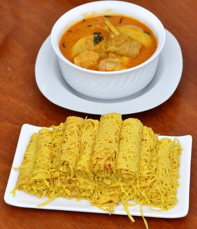Roti Jala (Malaysian Net Crepes), and chicken curry traditional Malaysian Foodの写真素材