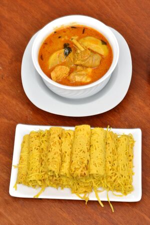 Roti Jala (Malaysian Net Crepes), and chicken  curry traditional Malaysian Foodの写真素材