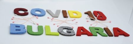CONCEPT COVID-19 PENDAMIC  The coronavirus COVID-19 is affecting 210 countries include Bulgaria. White background and some blur effect. Colourful felt Text .の写真素材