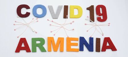 CONCEPT COVID-19 PENDAMIC  The coronavirus COVID-19 is affecting 210 countries include Armenia. White background and some blur effect. Colourful felt Text .の写真素材