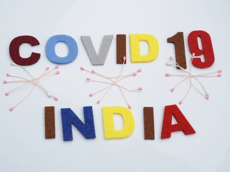 CONCEPT COVID-19 PENDAMIC  The coronavirus COVID-19 is affecting 210 countries include India. White background and some blur effect. Colourful felt Text .の写真素材