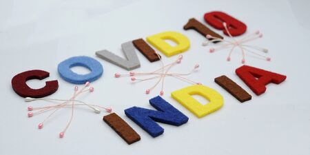 CONCEPT COVID-19 PENDAMIC  The coronavirus COVID-19 is affecting 210 countries include India. White background and some blur effect. Colourful felt Text .の写真素材