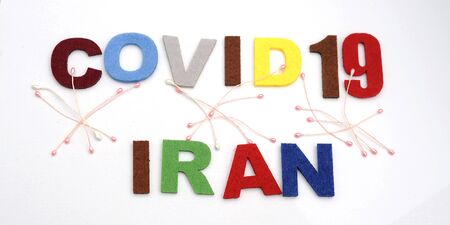 CONCEPT COVID-19 PENDAMIC  The coronavirus COVID-19 is affecting 210 countries include Iran. White background and some blur effect. Colourful felt Text .の写真素材
