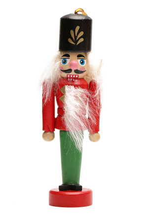 A wooden nutcracker isolated on a white background
