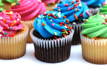Multicolored Cupcakes Isolated on a White Backgroundの写真素材