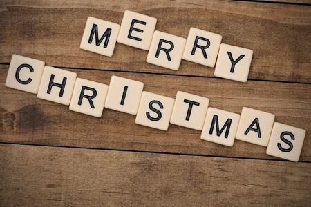 Merry Christmas spelled out in tan tile lettersの写真素材