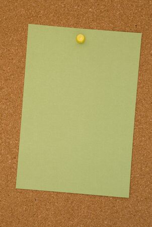 Blank Green Paper on a Cork Boardの写真素材