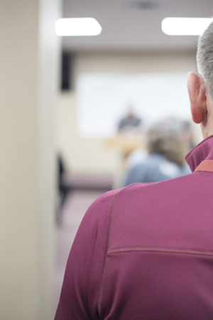 A classroom full of adults listening to a lecture の写真素材